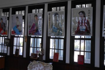 <p>Posters of Japanese women wearing wonderful silk kimonos</p>