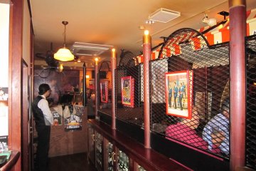The booth partitioned by meshed wire can be used for a private party