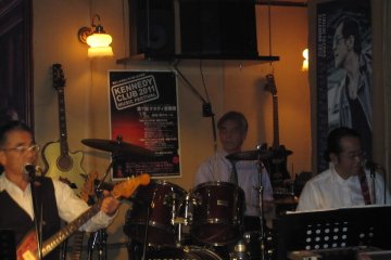One of the customers playing the drums impromptu