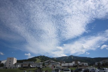 Front view of the hotel with the autumn mackerel sky in the background