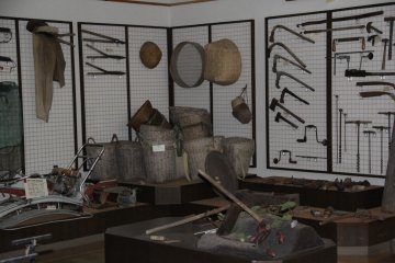 <p>Thank goodness for the clever display; the tool in the foreground was used in the harvesting of the beloved Okinawan sweet potato</p>