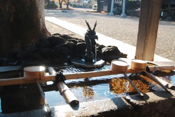 Chōzuya or purification font to clean your hands and rinse your mouth.