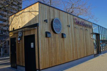 <p>The newly constructed modern box-like&nbsp;structure of the Tully's Coffee shop at the Sumida&nbsp;Park Open Cafe</p>