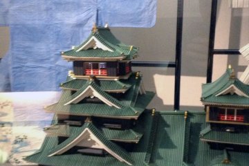 <p>A paper castle stands proudly in front of paper clothing once worn by a famous kabuki actor.&nbsp;</p>