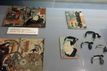 <p>An old paper toy that allows the user to switch hair styles of the man on the card.</p>
