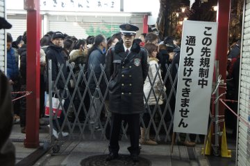 The small streets&nbsp;on the sides of the shops are well guarded by security staff, and no person is allowed to trespass and get in between&nbsp;jumping the queue. That's&nbsp;Japanese orderliness and discipline...