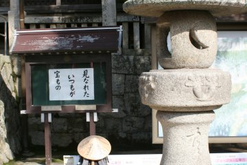 A pilgrim's belongings rest near the hall