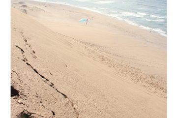 Footprints left behind on the smooth sand