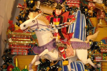 Warrior riding Yamakasa Festival float.