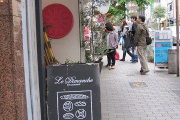 <p>Find Le Dimanche bakery by looking for&nbsp;the pretzel outside the store</p>