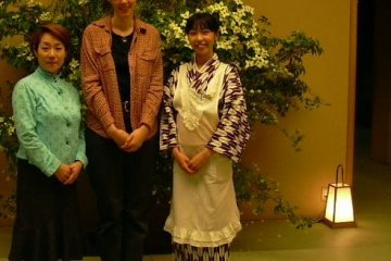 <p>This photo was taken during my first visit to the restaurant. I am in the center;&nbsp;that's my student on my left, and our server on my right. I include it so that you can see the server's kimono</p>