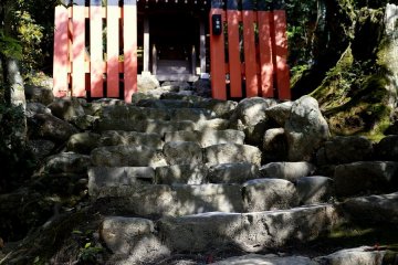 Massive stone steps leading to a small altar