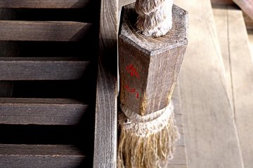<p>Well worn pull rope for ringing the bell above the offering box</p>