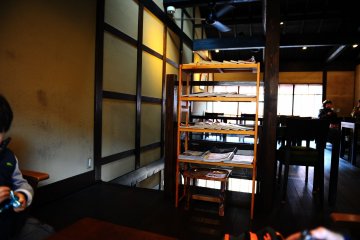 <p>The upstairs cafe space is cozy and open.</p>