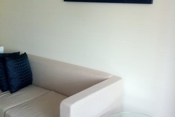 living room has modern white furniture and has an airy feel