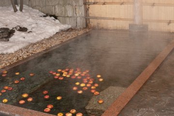 The onsen in the evening, with apples floating in the water that gave off a beautiful scent.