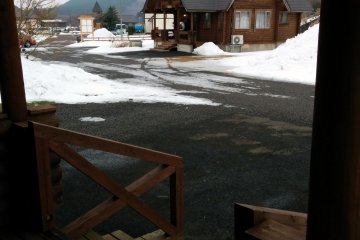 <p>A view of the opposite log house from the porch of the log house I stayed at.&nbsp;</p>