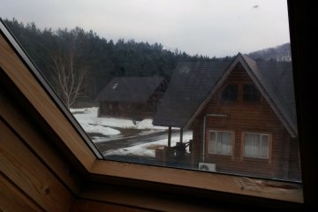 <p>Looking out a window from the second story of the log house. On clear nights, the resort is famous for its starry sky. Here you can see right from your bed!!</p>