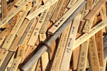 Wooden swords cover the warriors grave.