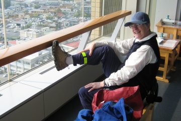 <p>When my mother visited from Canada,&nbsp;in 2008, we cycled to Ken-cho. The building had just been opened shortly before that. Here she is admiring the view, and taking a rest</p>
