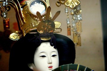 <p>Doll with ornate head-dress</p>